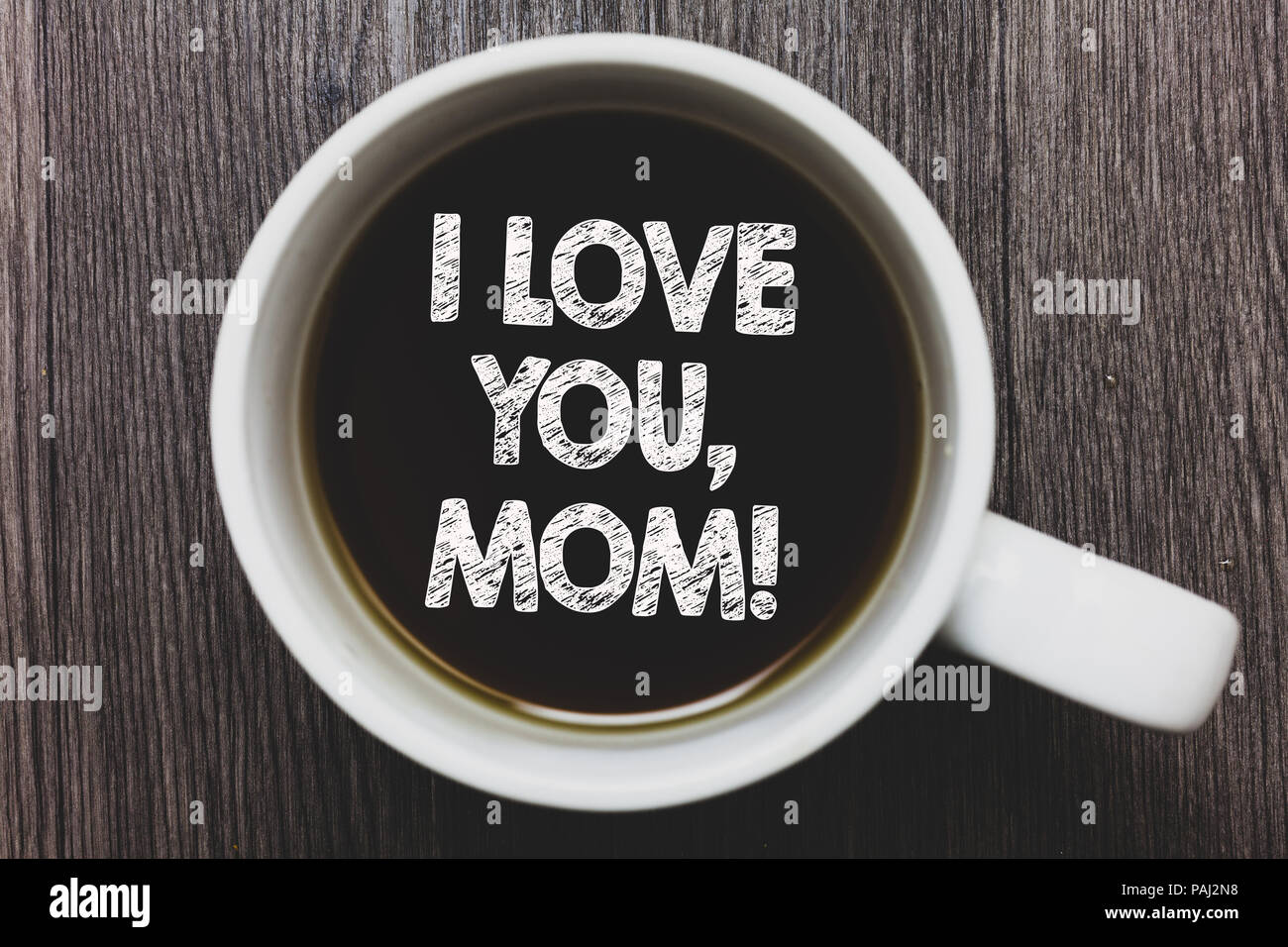 https://c8.alamy.com/comp/PAJ2N8/word-writing-text-i-love-you-mom-business-concept-for-loving-message-emotional-feelings-affection-warm-declaration-black-coffee-with-coffee-mug-floa-PAJ2N8.jpg
