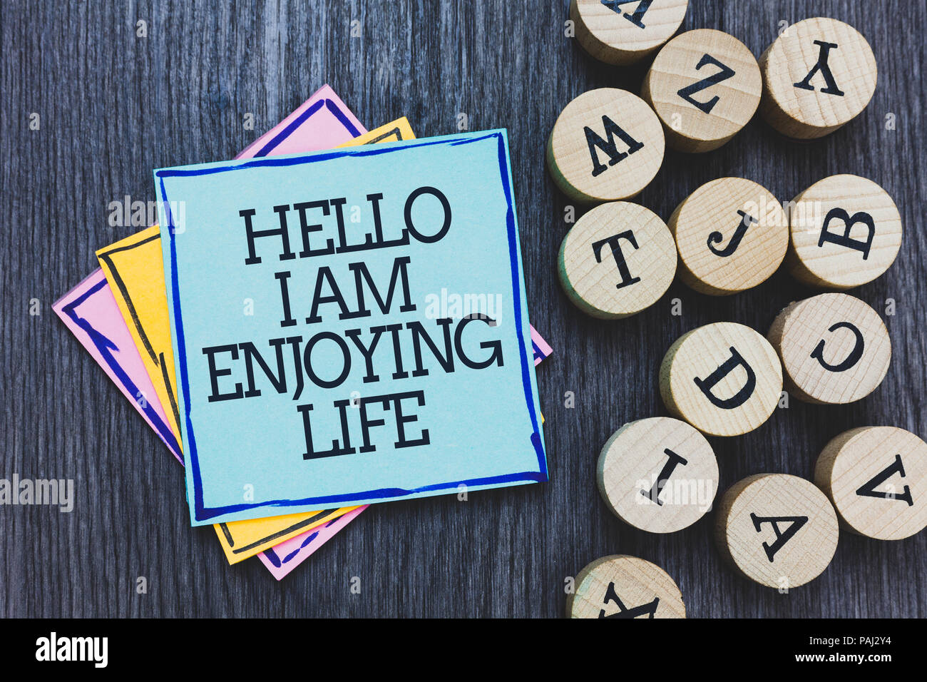 Handwriting Text Hello I Am Enjoying Life Concept Meaning Happy Relaxed Lifestyle Enjoy Simple Things Black Wooden Deck Written Sticky Note Beside So Stock Photo Alamy