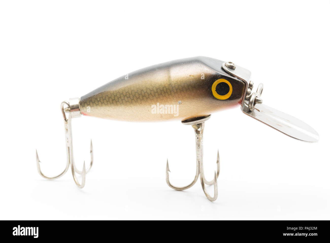A single vintage fishing lure equipped with treble hooks, possibly by Woods MFG, on a white background. These types of lures for catching predatory fi Stock Photo