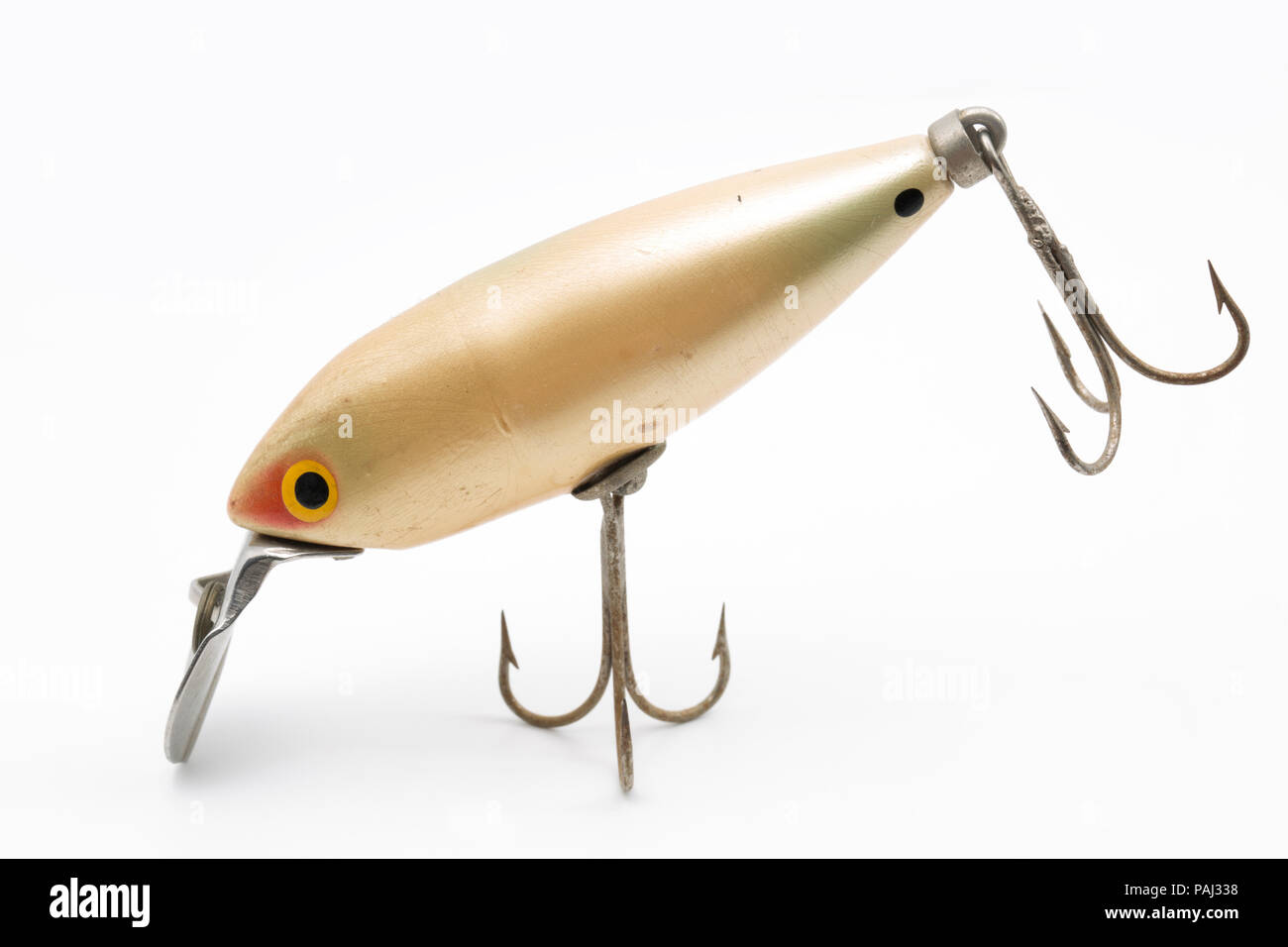 A single vintage fishing lure equipped with treble hooks, possibly by Woods MFG, on a white background. These types of lures for catching predatory fi Stock Photo