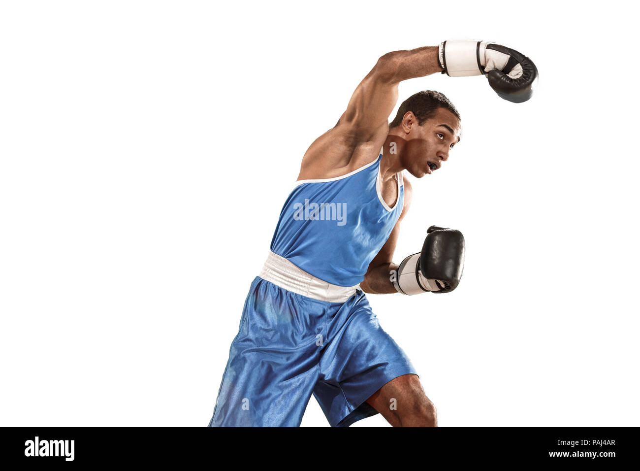Sporty man during boxing exercise Photo of boxer on white background Sporty man during boxing exercise Photo of boxer on white background