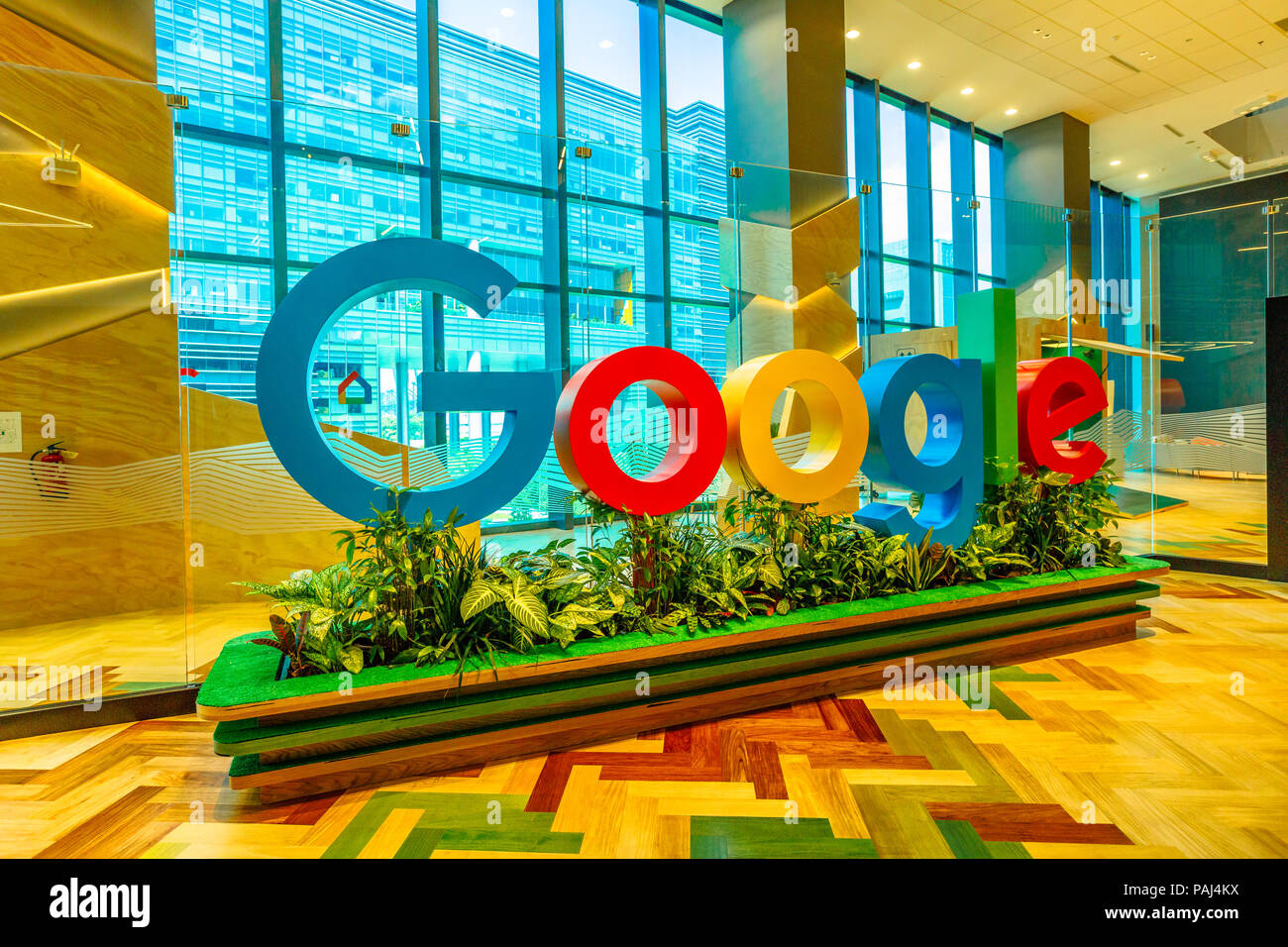 Singapore - May 5, 2018: closeup of Google sign inside a new office to house fast growing team of engineers in Singapore. Google's Asia-Pacific Headquarters con employs 1000 people. Stock Photo