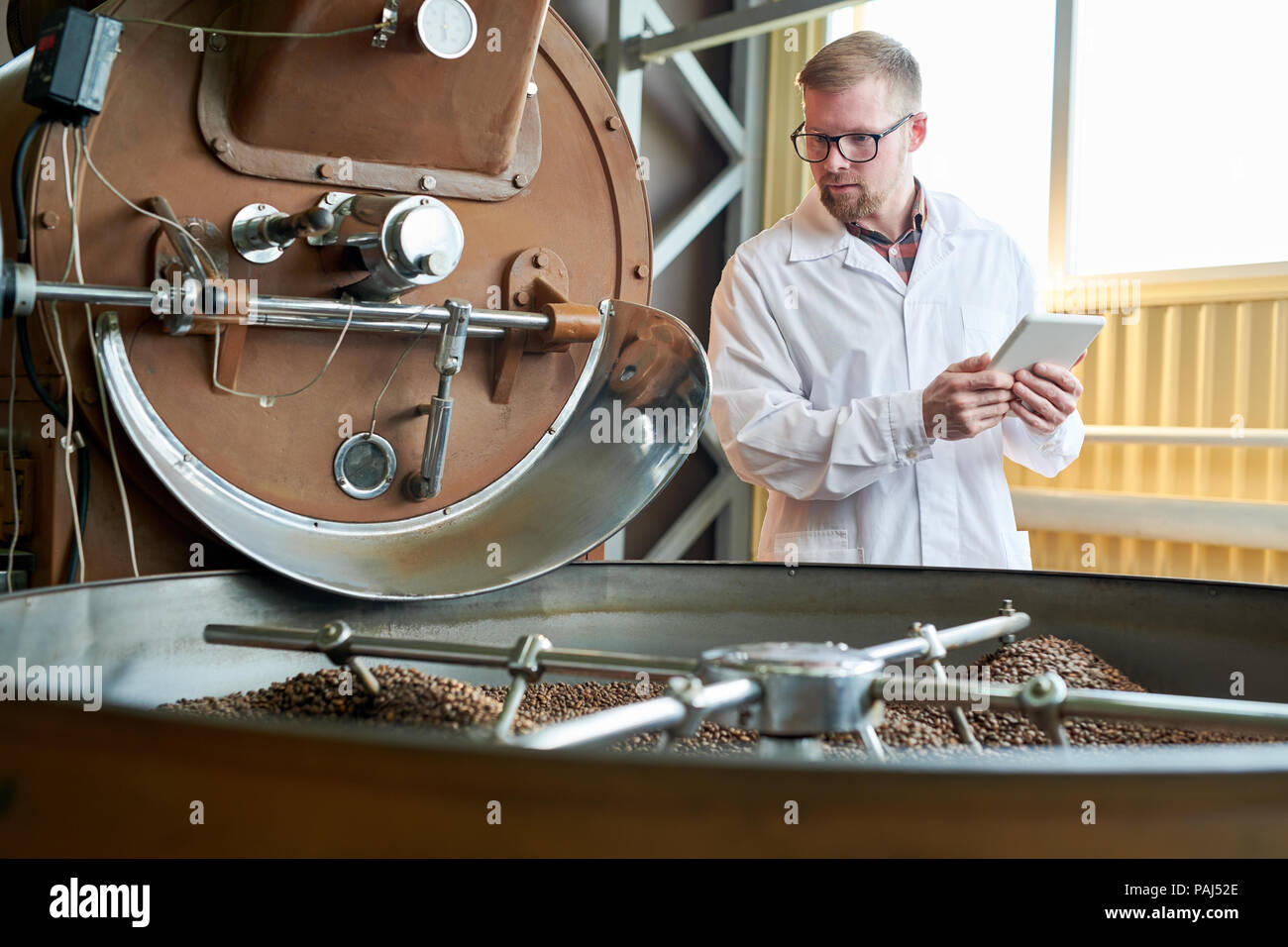 Modern Worker Roasting Coffee at Factory Stock Photo Alamy