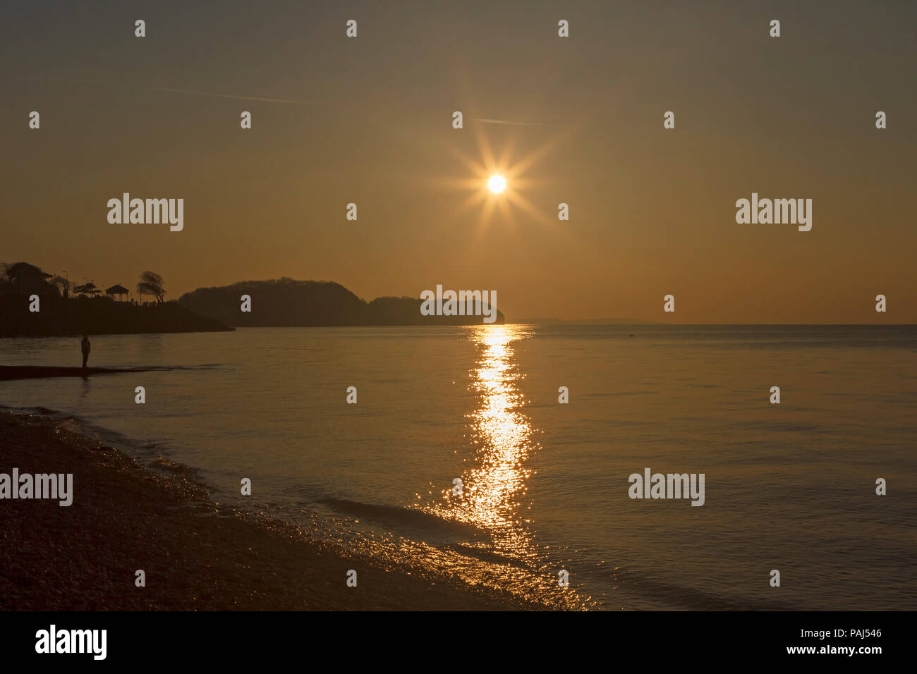 Streak of sunlight across the sea at sunset Stock Photo Alamy