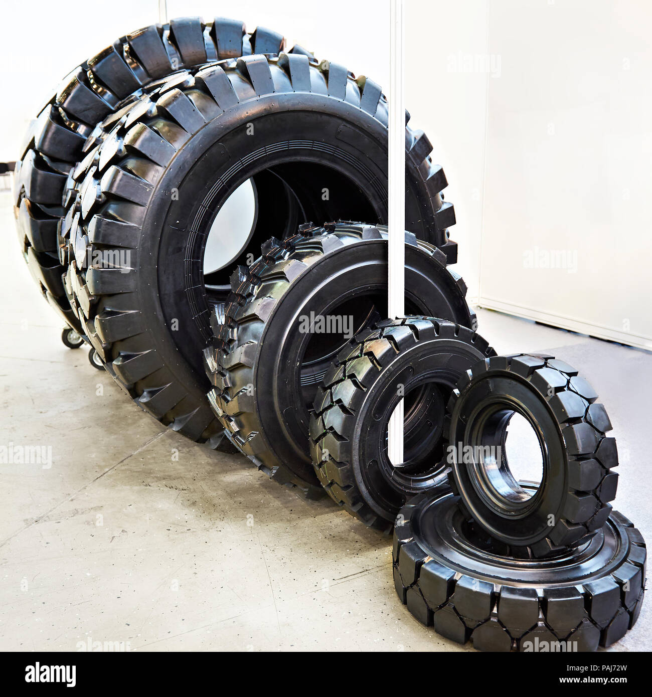Tires of different sizes for tractors in the store Stock Photo Alamy
