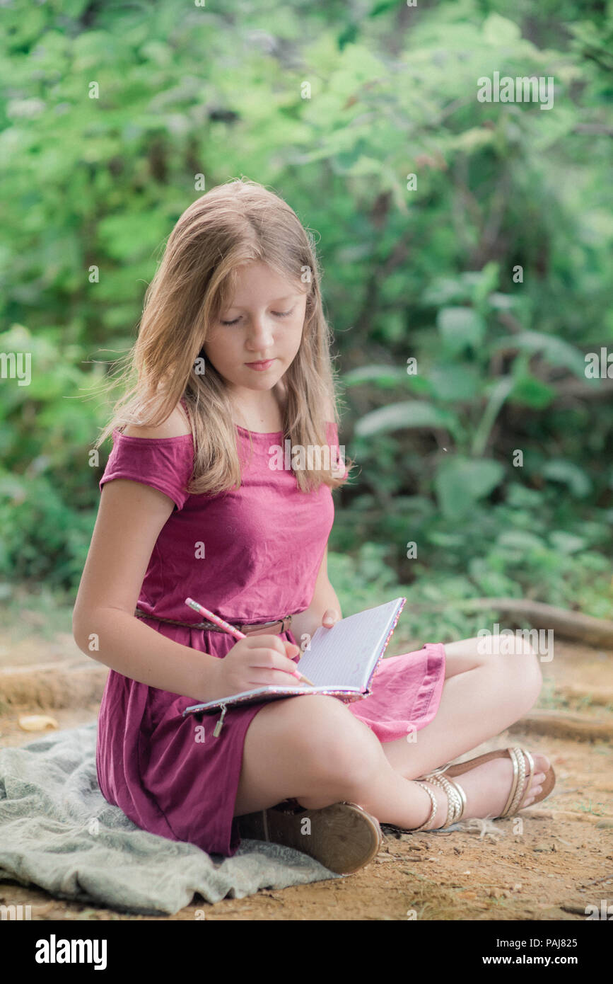 Pre teen girl outdoors Stock Photo