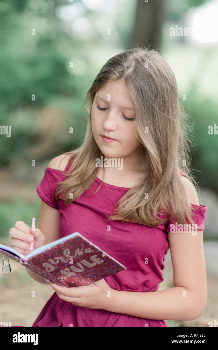 Pre teen girl outdoors Stock Photo