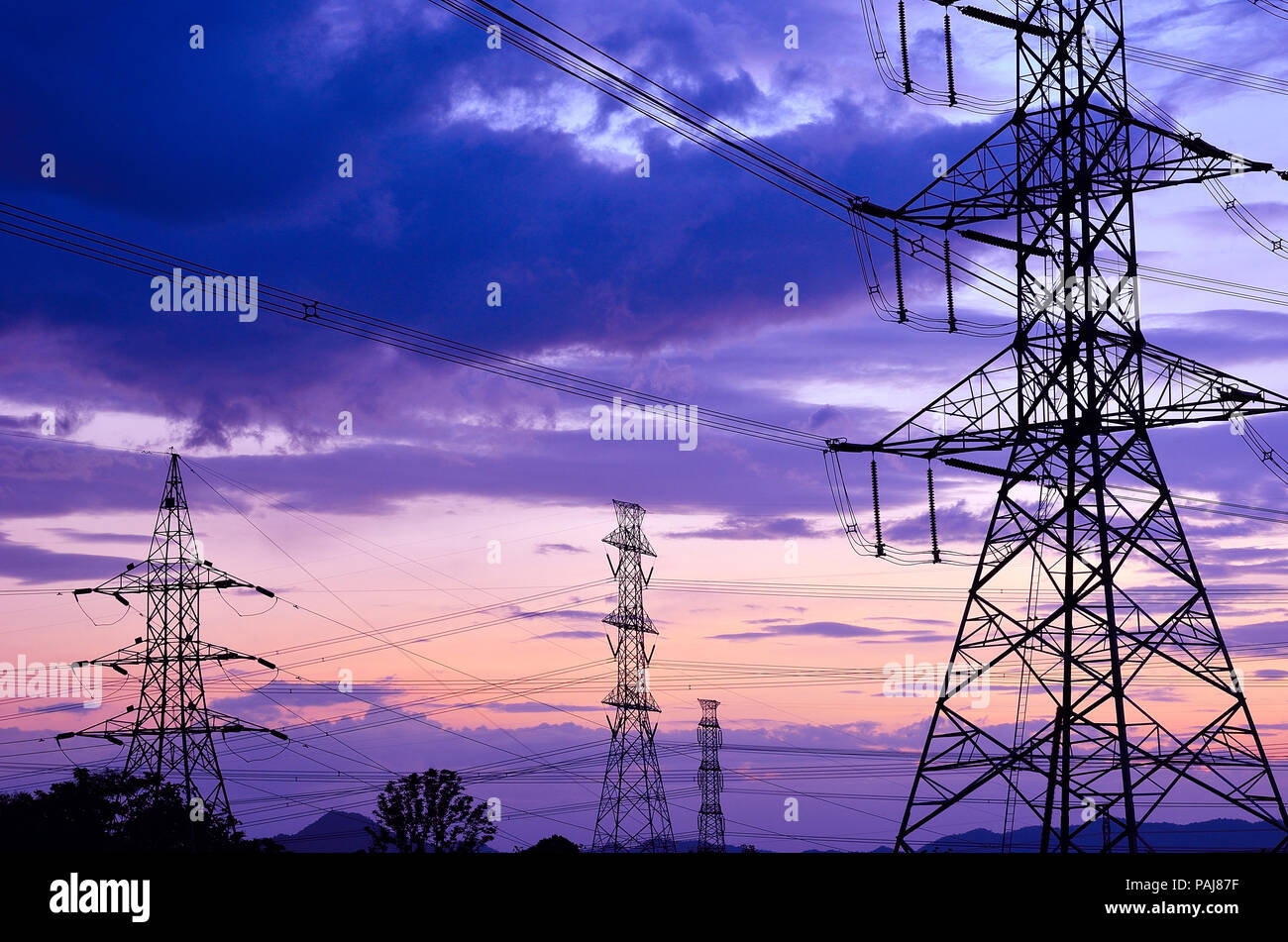 High voltage electricity pylon against blue sky Stock Photo - Alamy