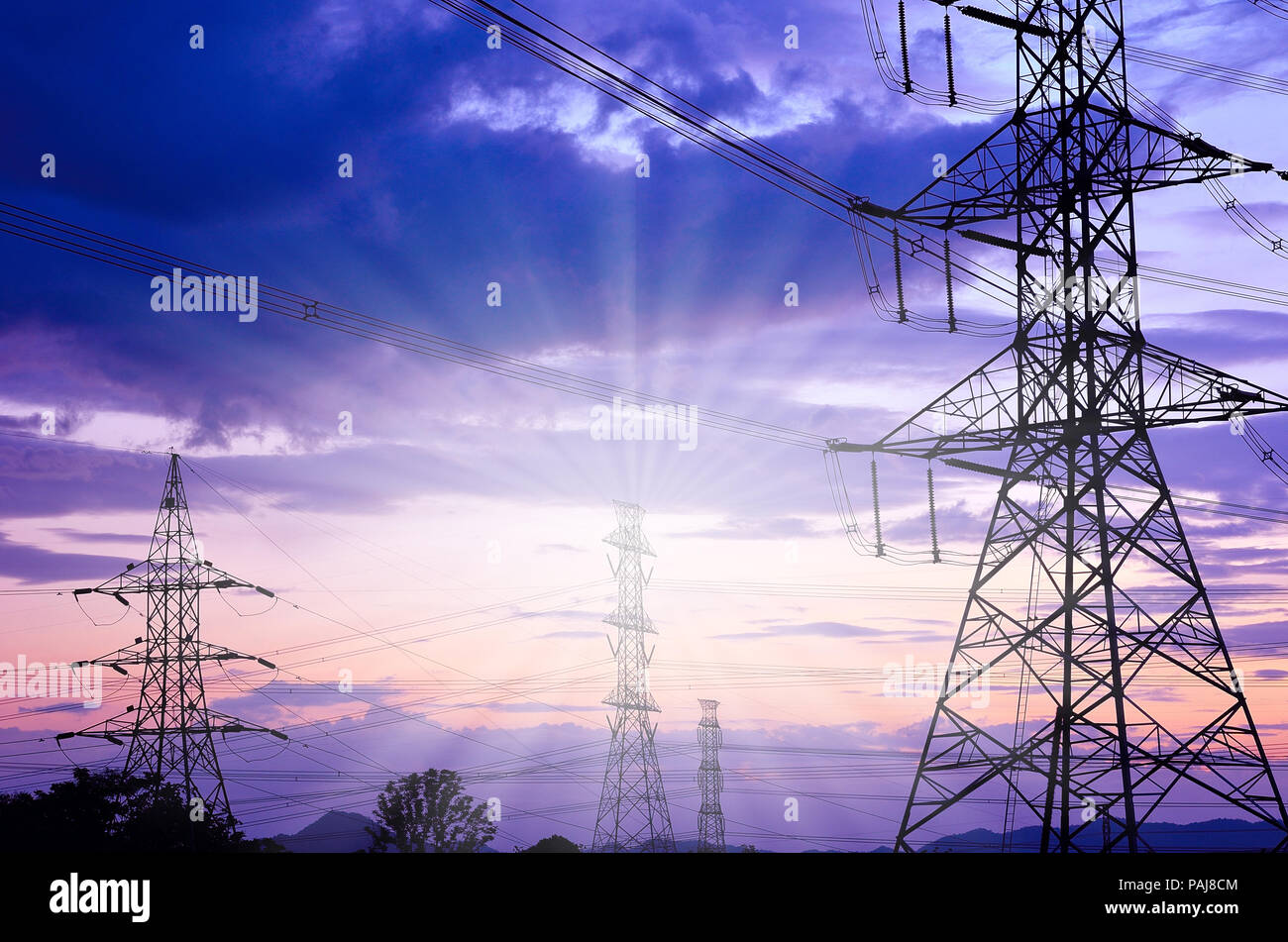 High voltage electricity pylon against blue sky Stock Photo - Alamy