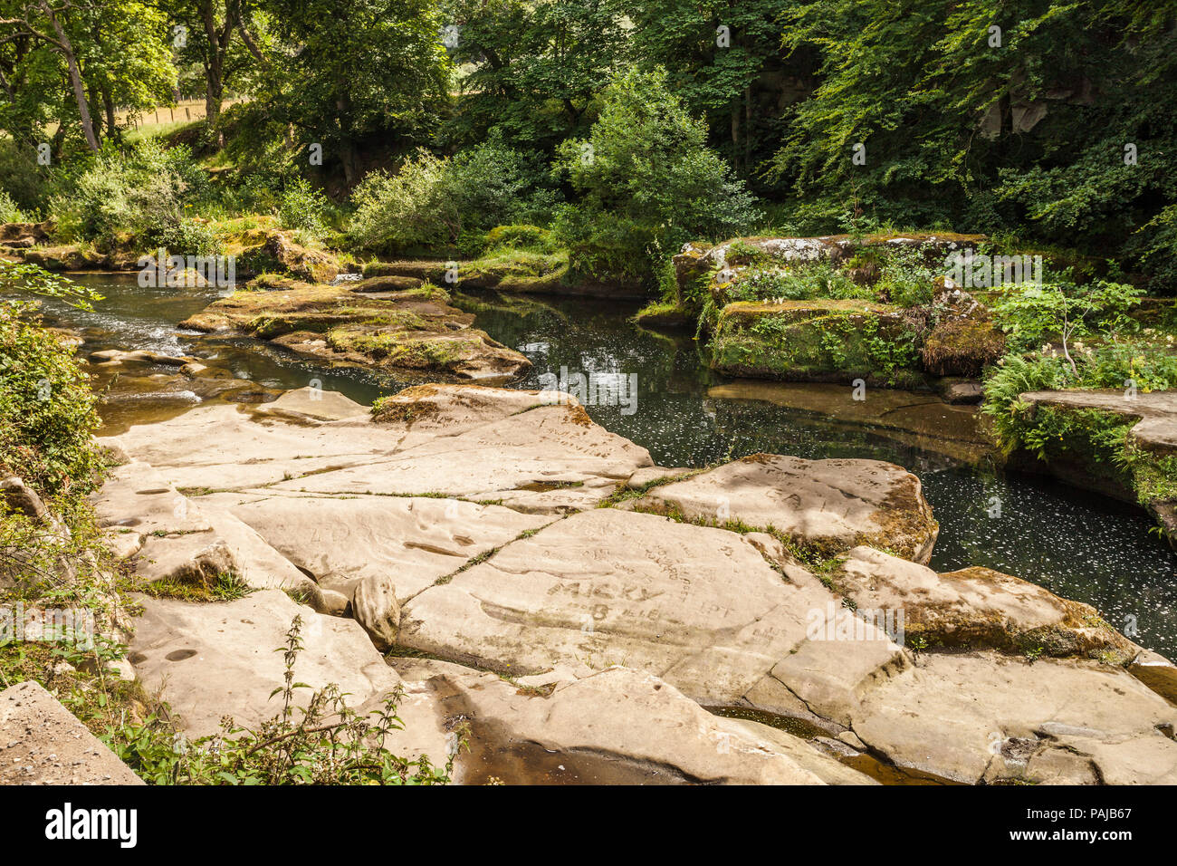 The River Coquet flowing through the centre of Rothbury,Northumberland ...