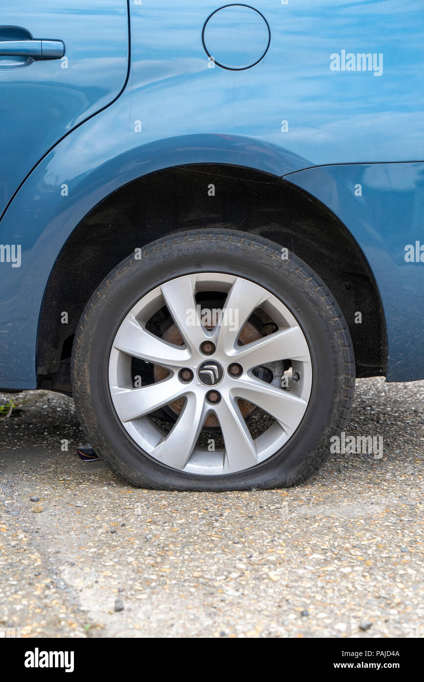 Car with flat tyre Stock Photo