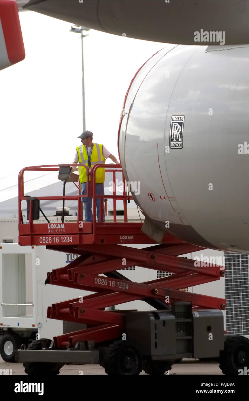 engineers on a cherry-picker inspecting the A380 Rolls-Royce Trent 970 engine at the 2005 Paris AirShow, Salon-du-Bourget Stock Photo