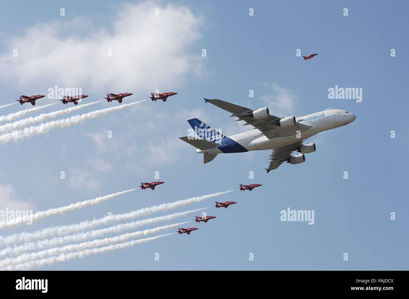 Airbus A380-800 and the Red Arrows BAE Hawks with smoke in the flying-display at the 2006 Farnborough International Airshow Stock Photo