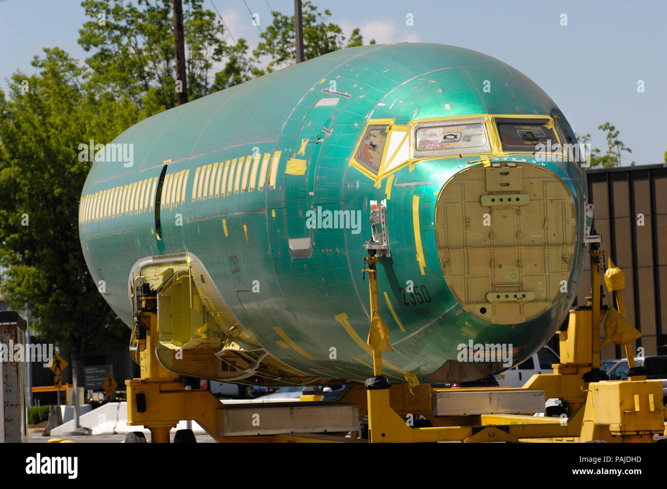 the fuselage of a Boeing 737-700 (LN2350) on a trolley outside the production factory Stock Photo