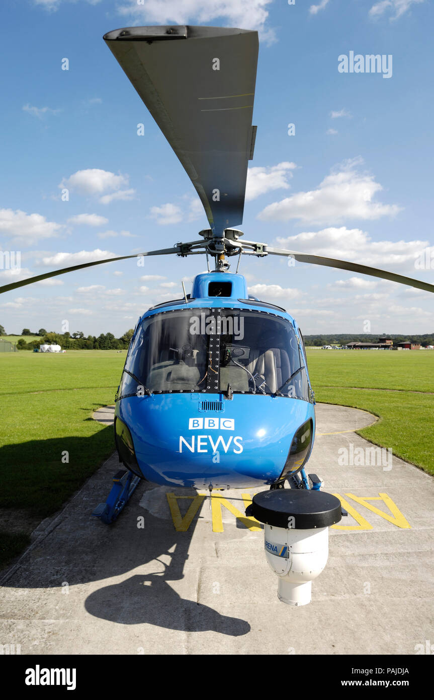 a BBC News Eurocopter AS-355F-1 Squirrel parked on the apron at Redhill Stock Photo