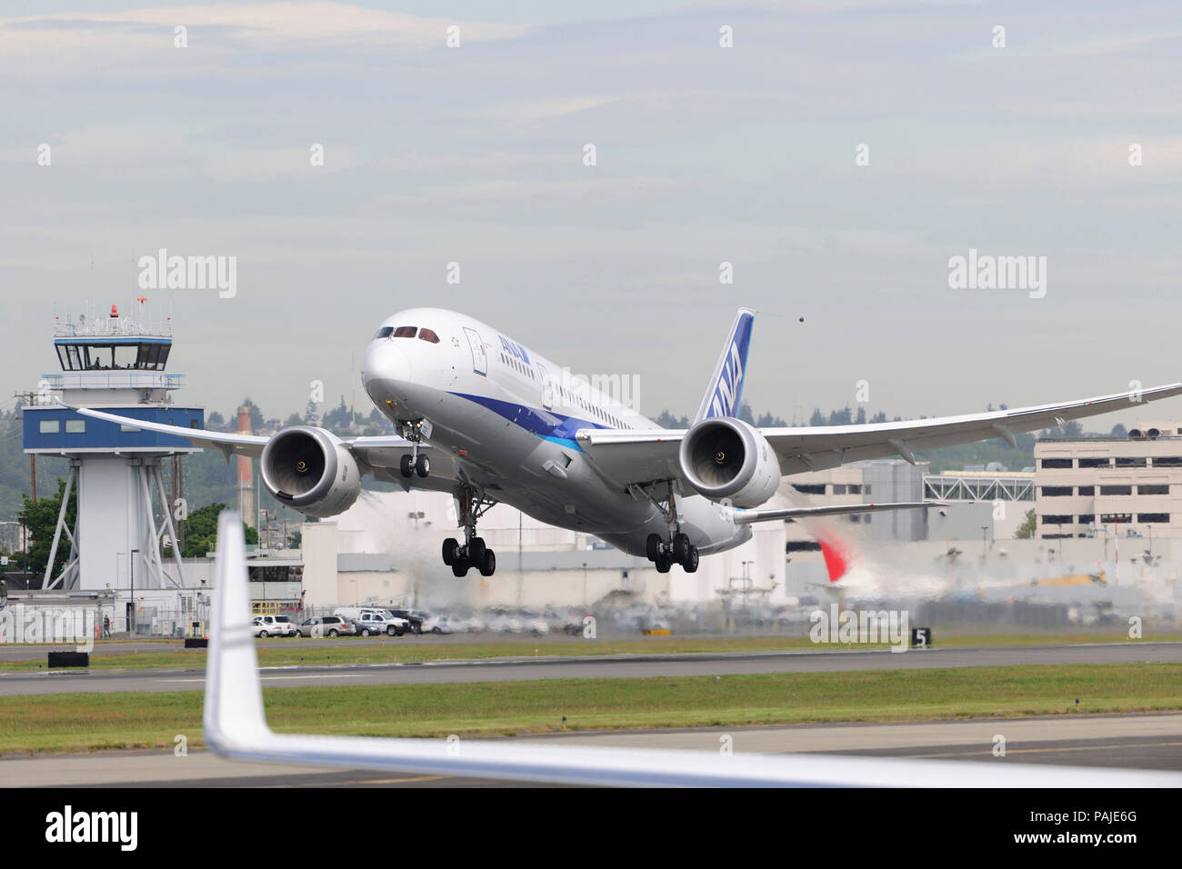 ana-all-nippon-airways-boeing-787-8-dreamliner-taking-off-stock-photo