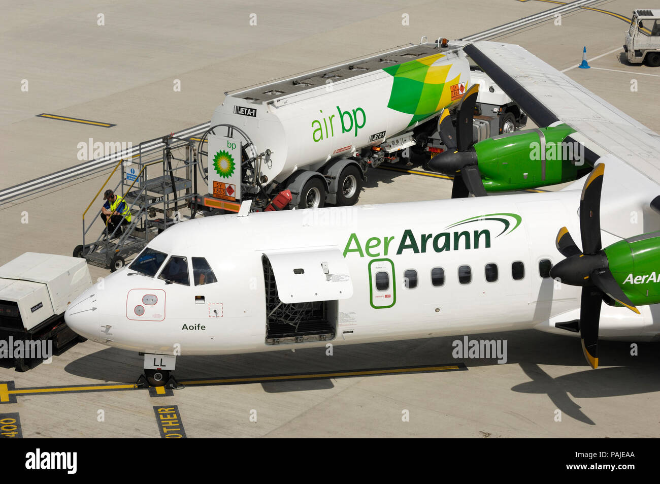 Aer Arann ATR 72-200 parked with Air Bp refuelling bowser behind at London City Stock Photo