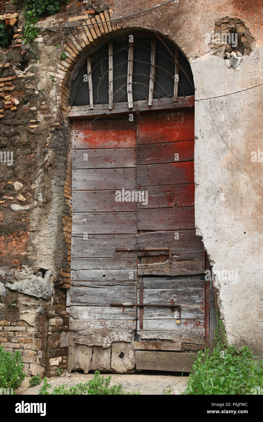 Casale of Vaccareccia - a brown wood old door in Appia Antica, Rome ...