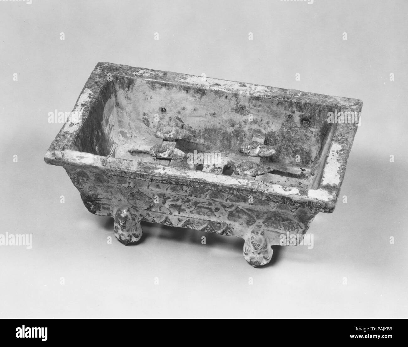 Model of a Rectangular Brazier. Culture: China. Dimensions: H. 3 9/16 in. (9 cm); W. 9 1/4 in. (23.5 cm). Date: 1st-2nd century. Museum: Metropolitan Museum of Art, New York, USA. Stock Photo