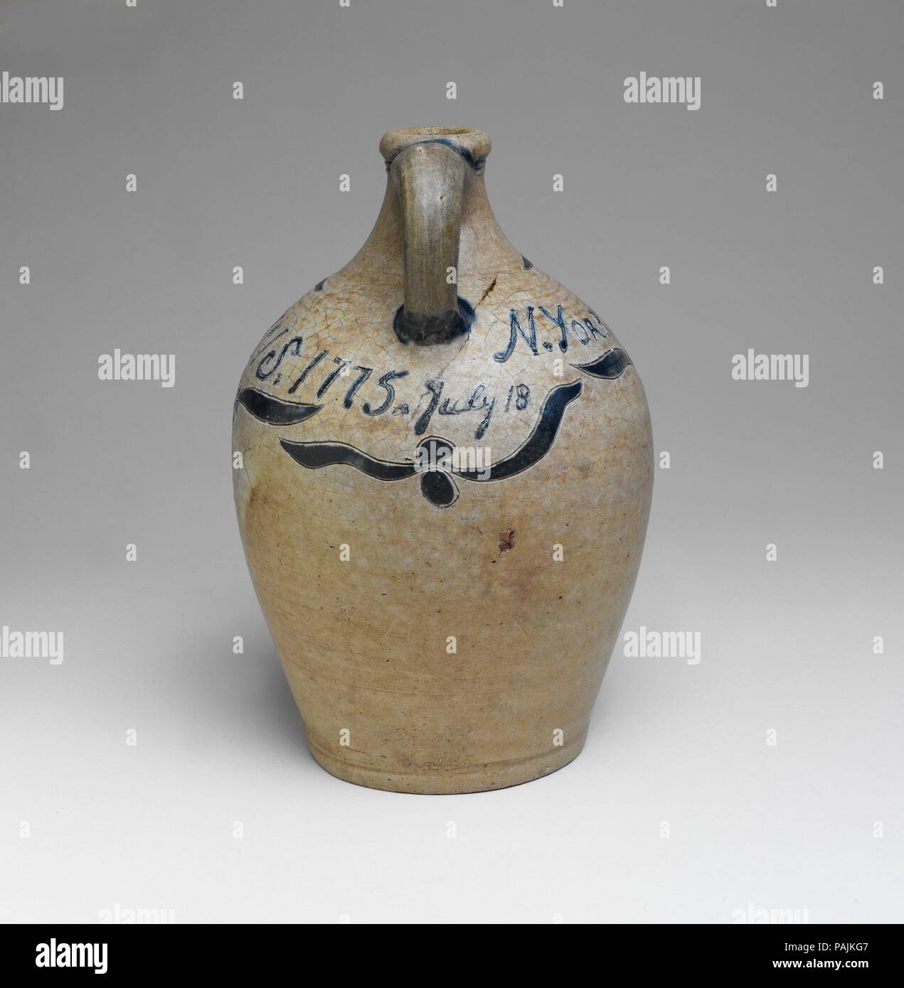 Jug. Culture: American. Dimensions: H. 10 in. (25.4 cm). Maker: John Crolius (1733-1812). Date: 1775.  This jug was probably made by John Crolius, whose family worked in New York City in an area known as Pot Baker's Hill, just north of what is now City Hall Park. He and his brother, William, were among the area's first potters. Their father had emigrated from Germany and founded a pottery, which the family ran until the mid-nineteenth century. The jug is signed and dated, which is rare in eighteenth-century American stoneware. Museum: Metropolitan Museum of Art, New York, USA. Stock Photo