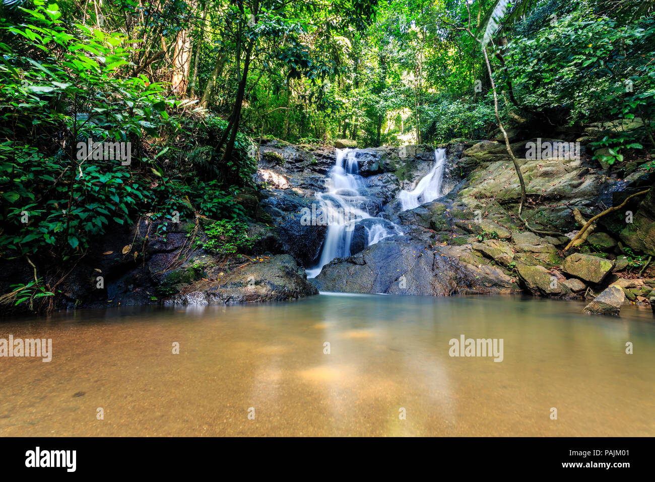 Kathu Waterfall In A Tropical Forest At Sunny Day Phuket Thailand kathu-waterfall-in-a-tropical-forest-at-sunny-day-phuket-thailand