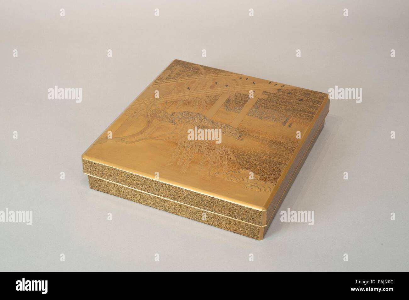 Box for Inkstone and Writing Implements (Suzuribako). Culture: Japan. Dimensions: H. 2 3/8 in. (6 cm); W. 9 1/2 in. (24.1 cm); L. 10 1/4 in. (26 cm). Date: 19th century.  With its wooden arched bridge, weirs of rocks in bamboo baskets and riverside willow, this landscape suggests the Bridge at Uji south of Kyoto, a place famed as a site of tragic romance in the Tale of Genji. Here, the novel motif of fireflies in black lacquer with highlights of iridescent shell adds a temporal note of summer evening to the scene. Museum: Metropolitan Museum of Art, New York, USA. Stock Photo