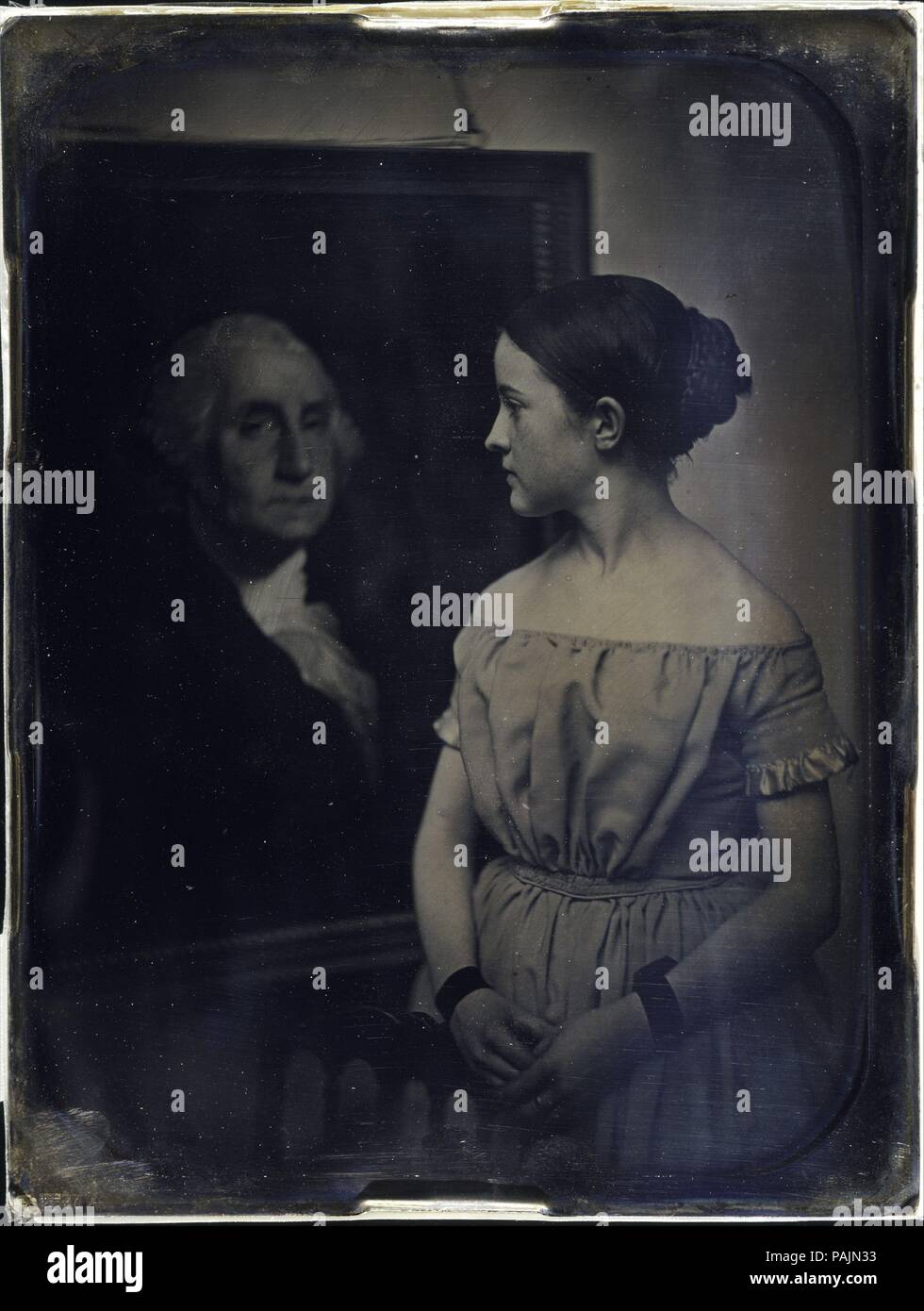 [Girl with Portrait of George Washingtion]. Artist: Albert Sands Southworth (American, West Fairlee, Vermont 1811-1894 Charlestown, Massachusetts); Josiah Johnson Hawes (American, Wayland, Massachusetts 1808-1901 Crawford Notch, New Hampshire). Dimensions: 21.6 x 16.5 cm (8 1/2 x 6 1/2 in.). Photography Studio: Southworth and Hawes (American, active 1843-1863). Date: ca. 1850.  The Boston partnership of Southworth and Hawes produced the finest portrait daguerreotypes in America for a clientele that included the leading political, intellectual, and artistic figures.  This first photographic pro Stock Photo