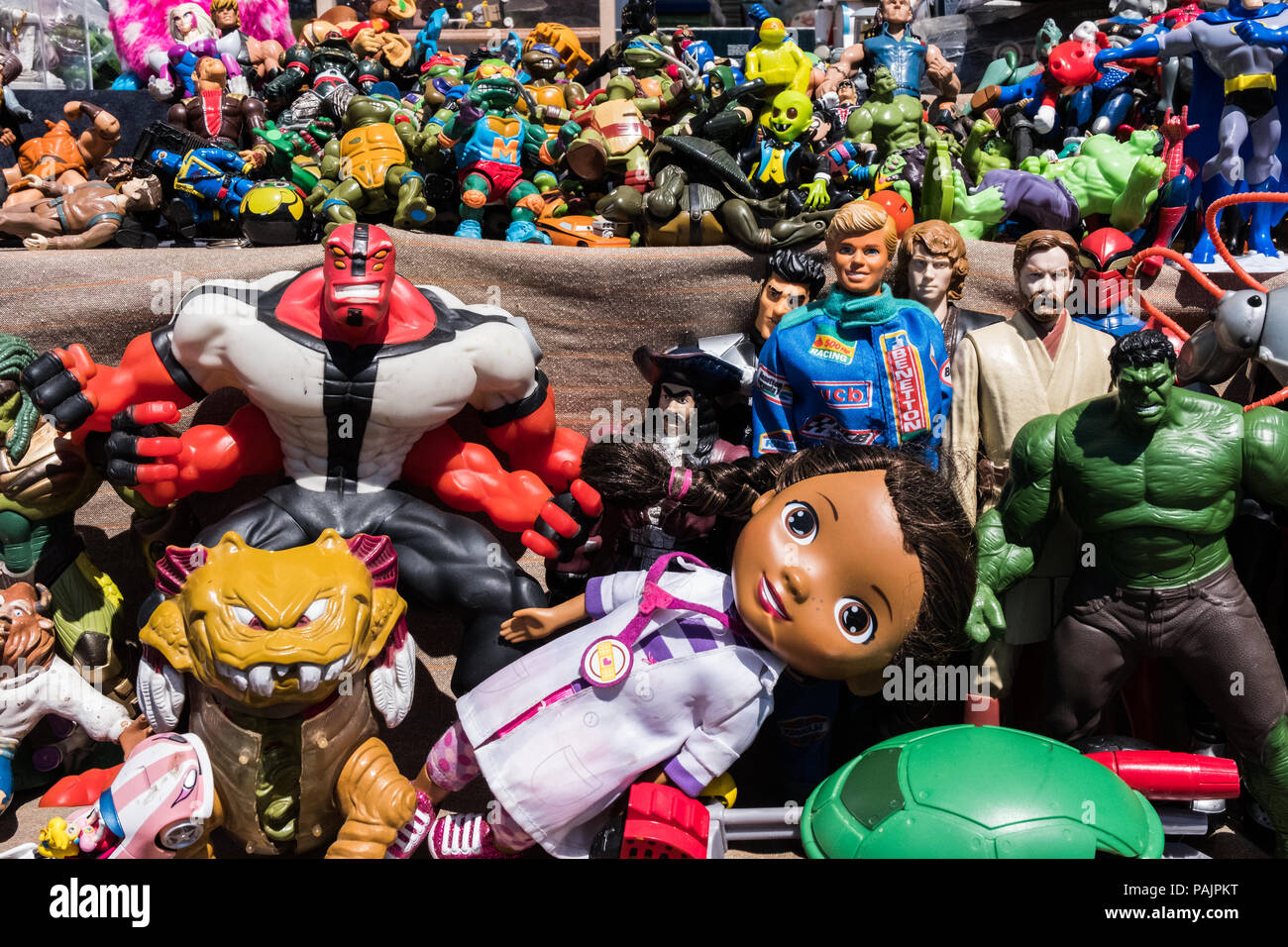 Beautiful colourful wallpaper background image of cartoon and film action  figures toys and dolls at a memorabilia store. No people Stock Photo - Alamy