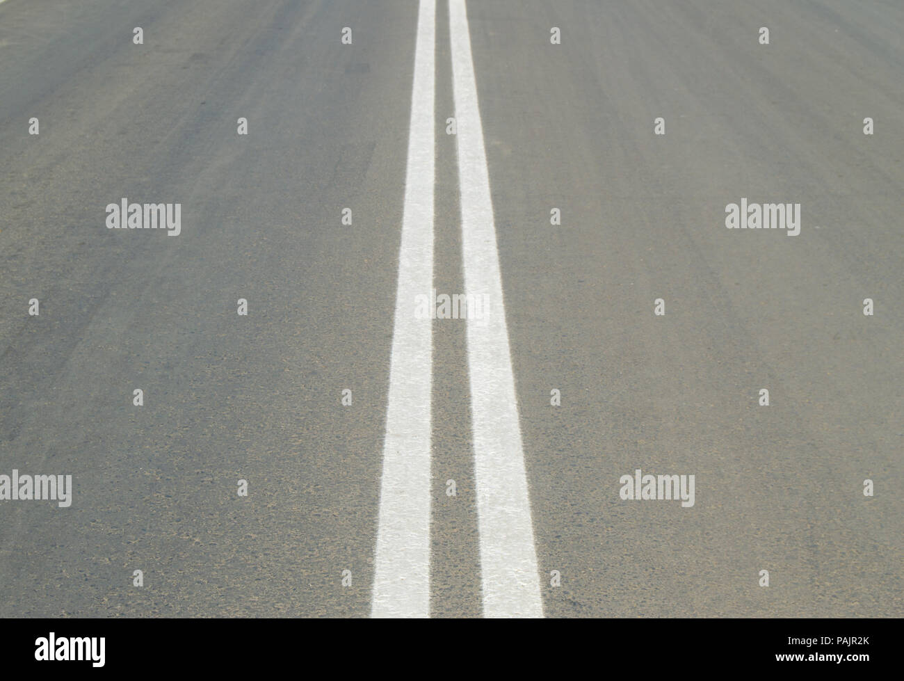 Markings on the road double solid line Stock Photo Alamy