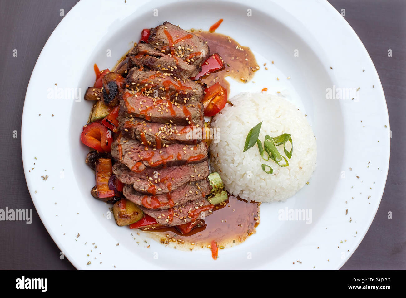 Kobe beef ribeye steak, vibrant, sliced steak on grilled vegetables ...