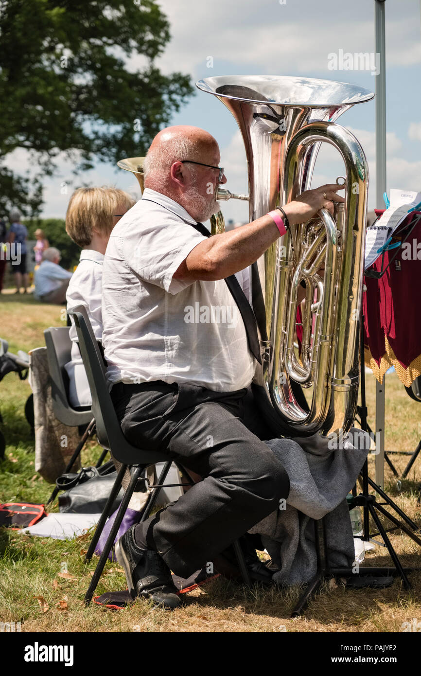 Powys, Wales, UK. A member of the Knighton Town Silver Band plays the euphonium at a local carnival Stock Photo