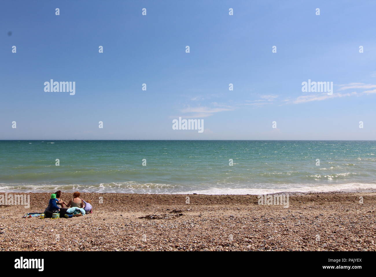Tide coming in on pebbled beach in Goring by sea Stock Photo Alamy