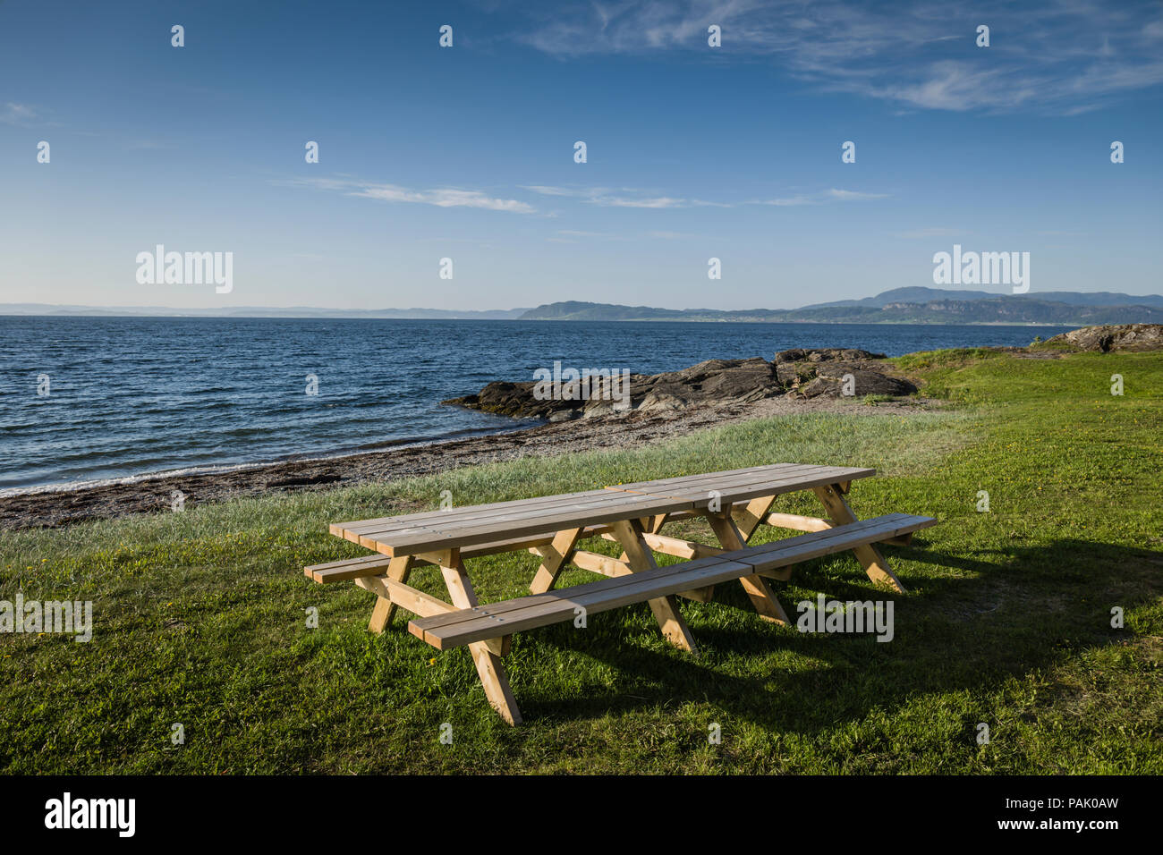 Picnic table by the fjord, Trondheim, Norway. Stock Photo