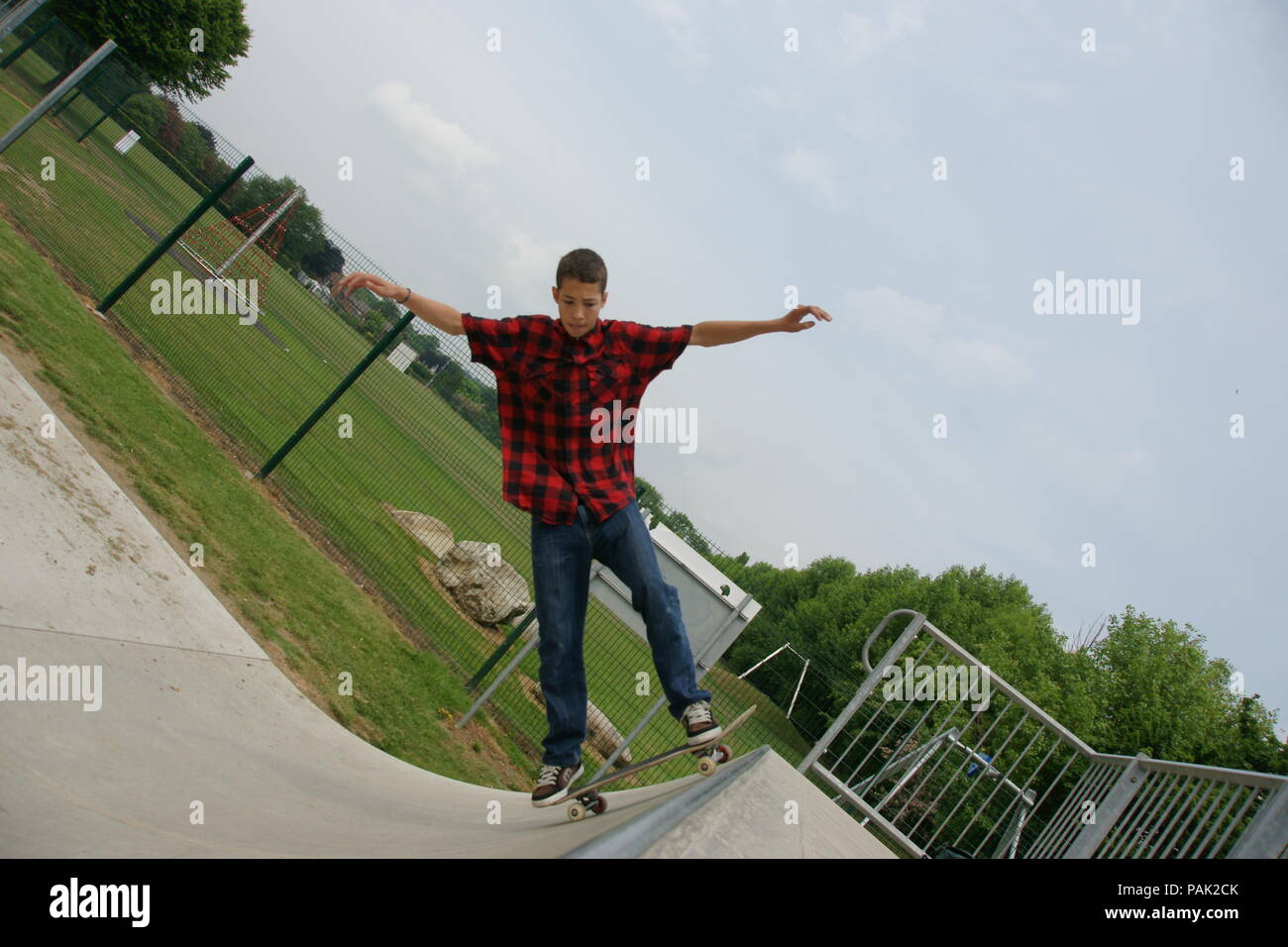 Skateboarding at a skate park Stock Photo