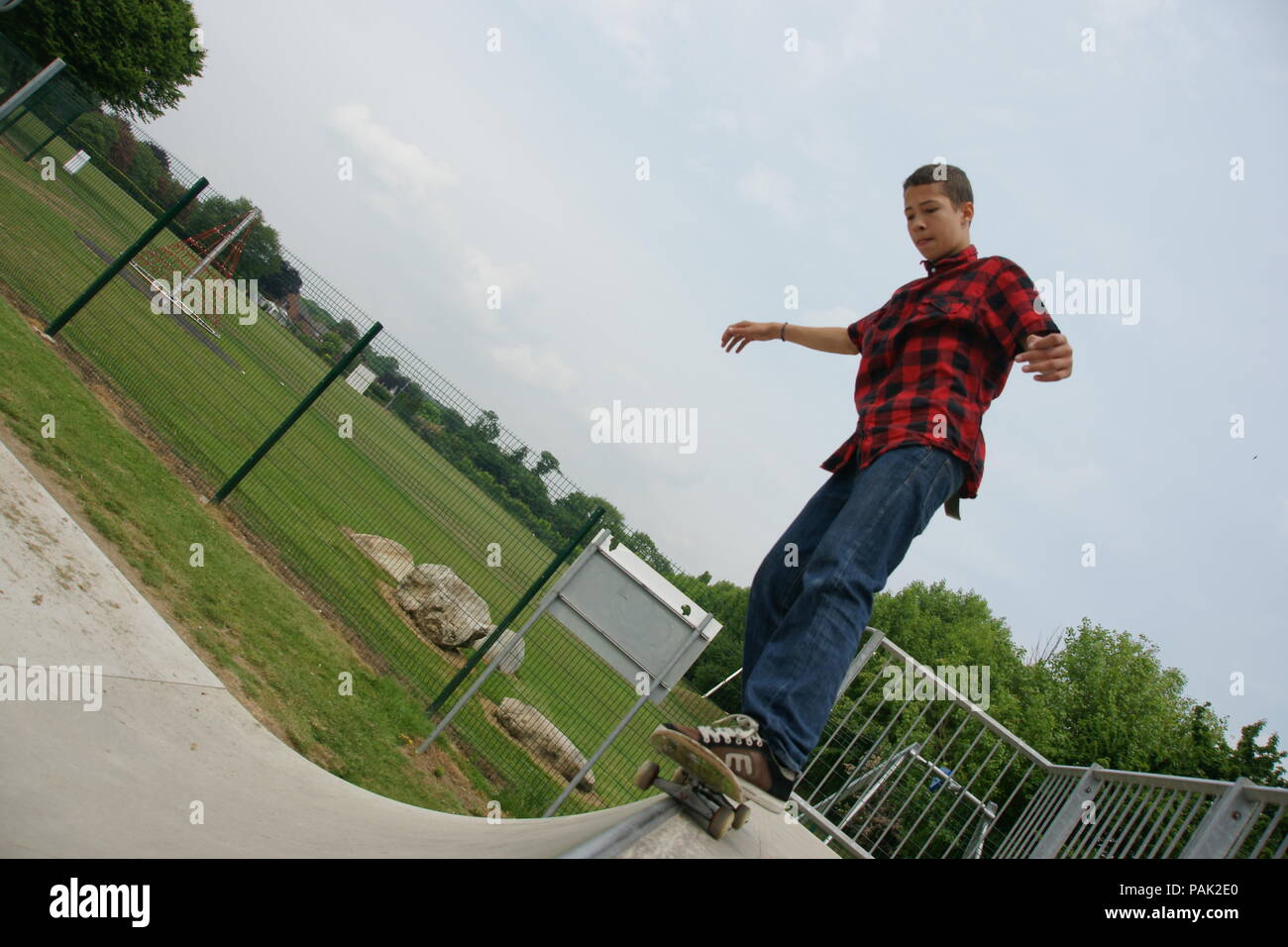 Skateboarding at a skate park Stock Photo