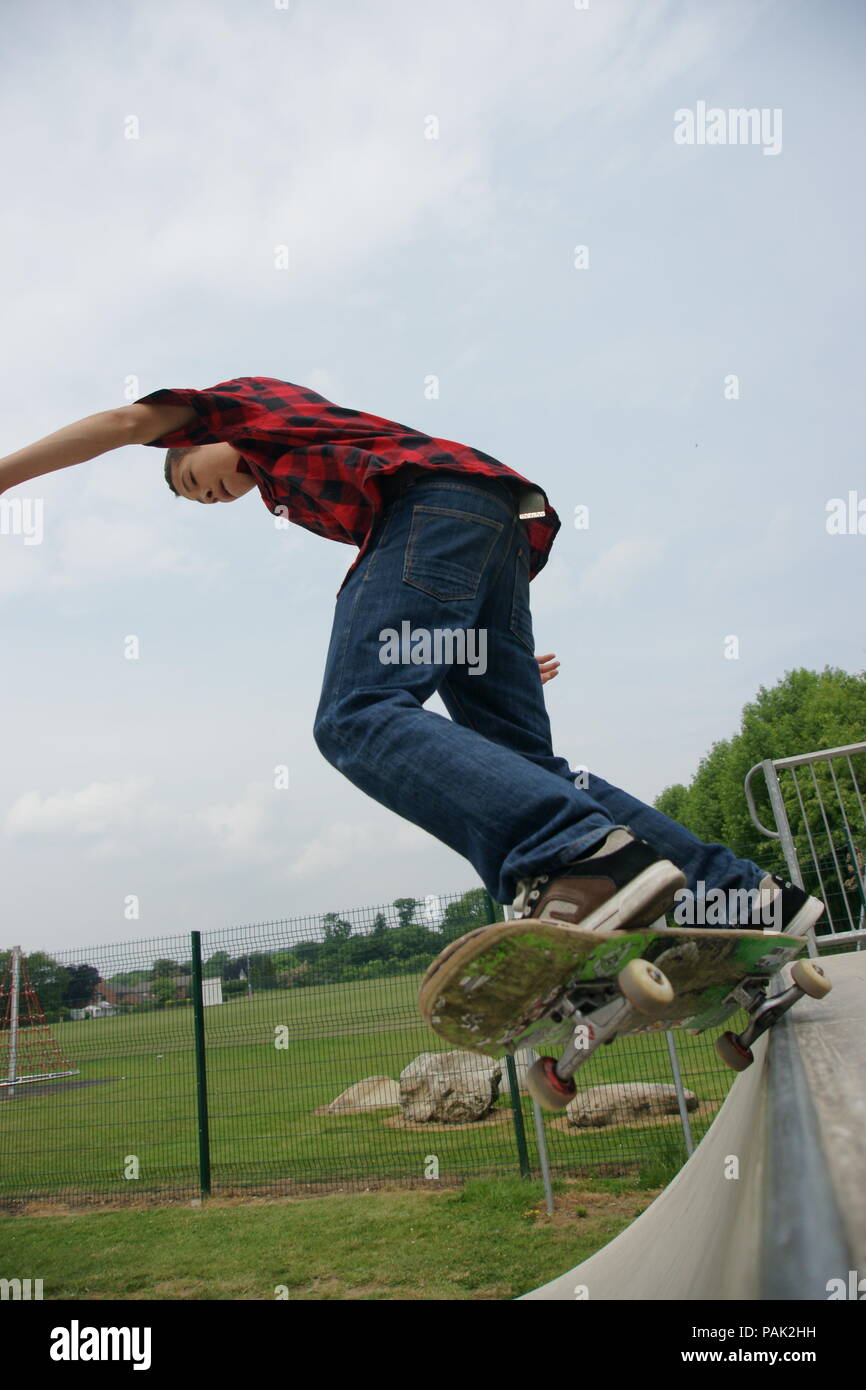 Skateboarding at a skate park Stock Photo