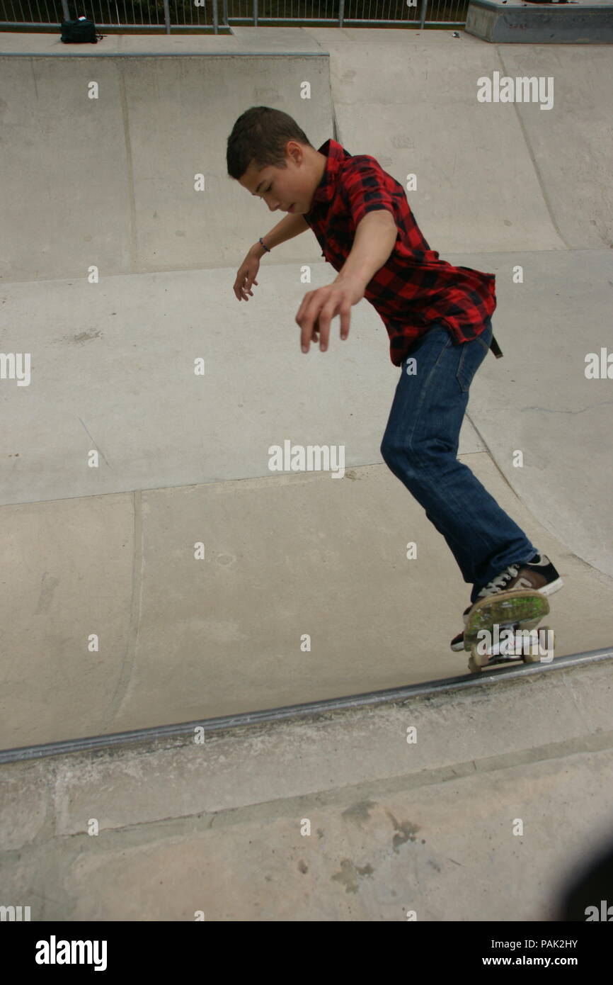 Skateboarding at a skate park Stock Photo