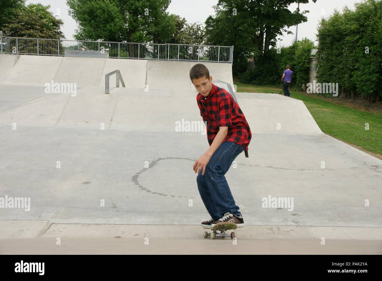 Skateboarding at a skate park Stock Photo