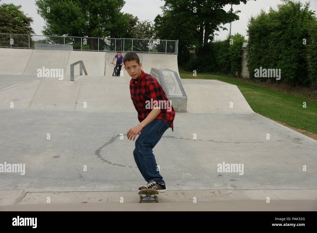 Skateboarding at a skate park Stock Photo