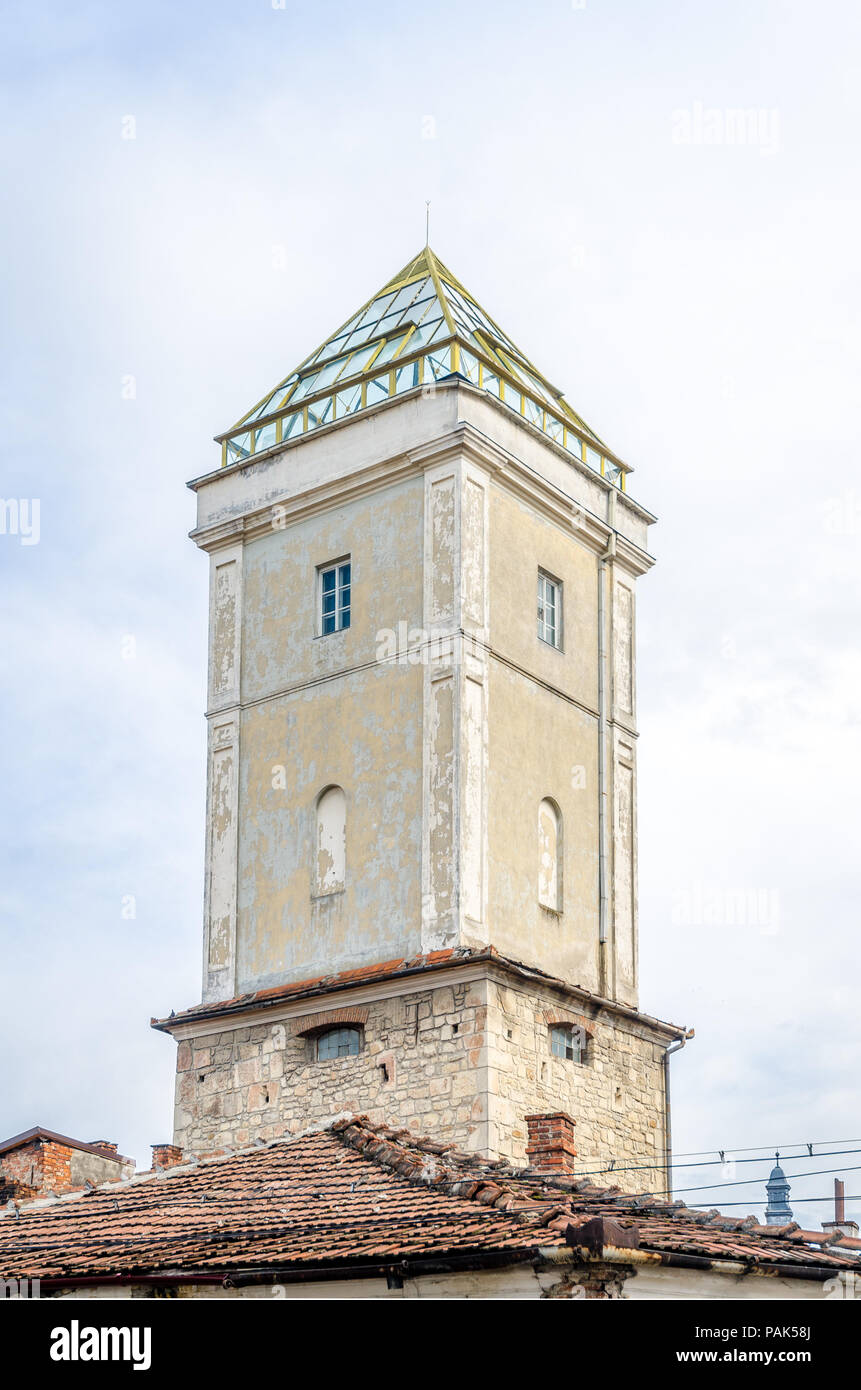 Fireman's tower in the medieval historic center of Cluj Napoca city in Transylvania region of Romania. A mixture of medieval, baroque and modern archi Stock Photo