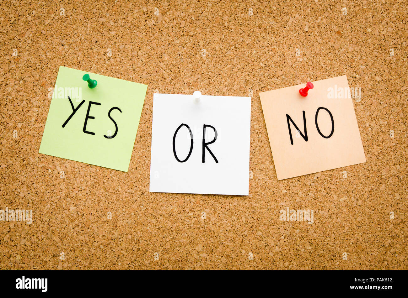 YES OR NO written on red white and green post notes pinned to a board suggesting options to accept or deny in a bussines look in landscape mode Stock Photo