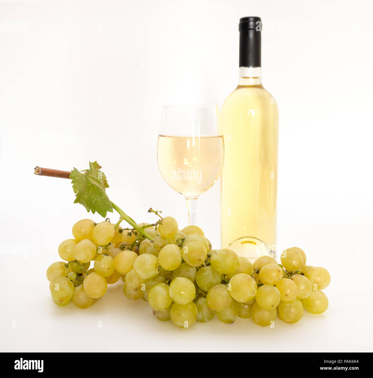 Download Yellow Wine In A Glass With Grapes A Bottle And A Vine Leaf Stock Photo 213093304 Alamy PSD Mockup Templates