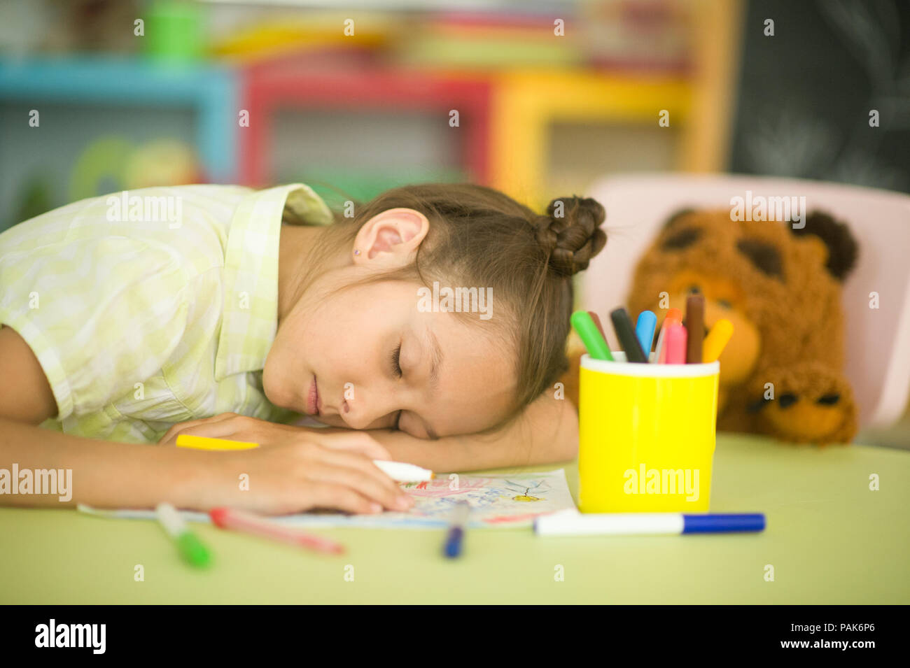 Tired schoolgirl fall asleep Stock Photo