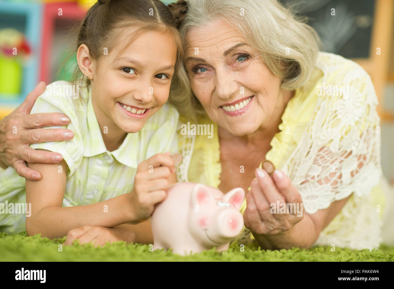 old woman with piggy bank Stock Photo - Alamy