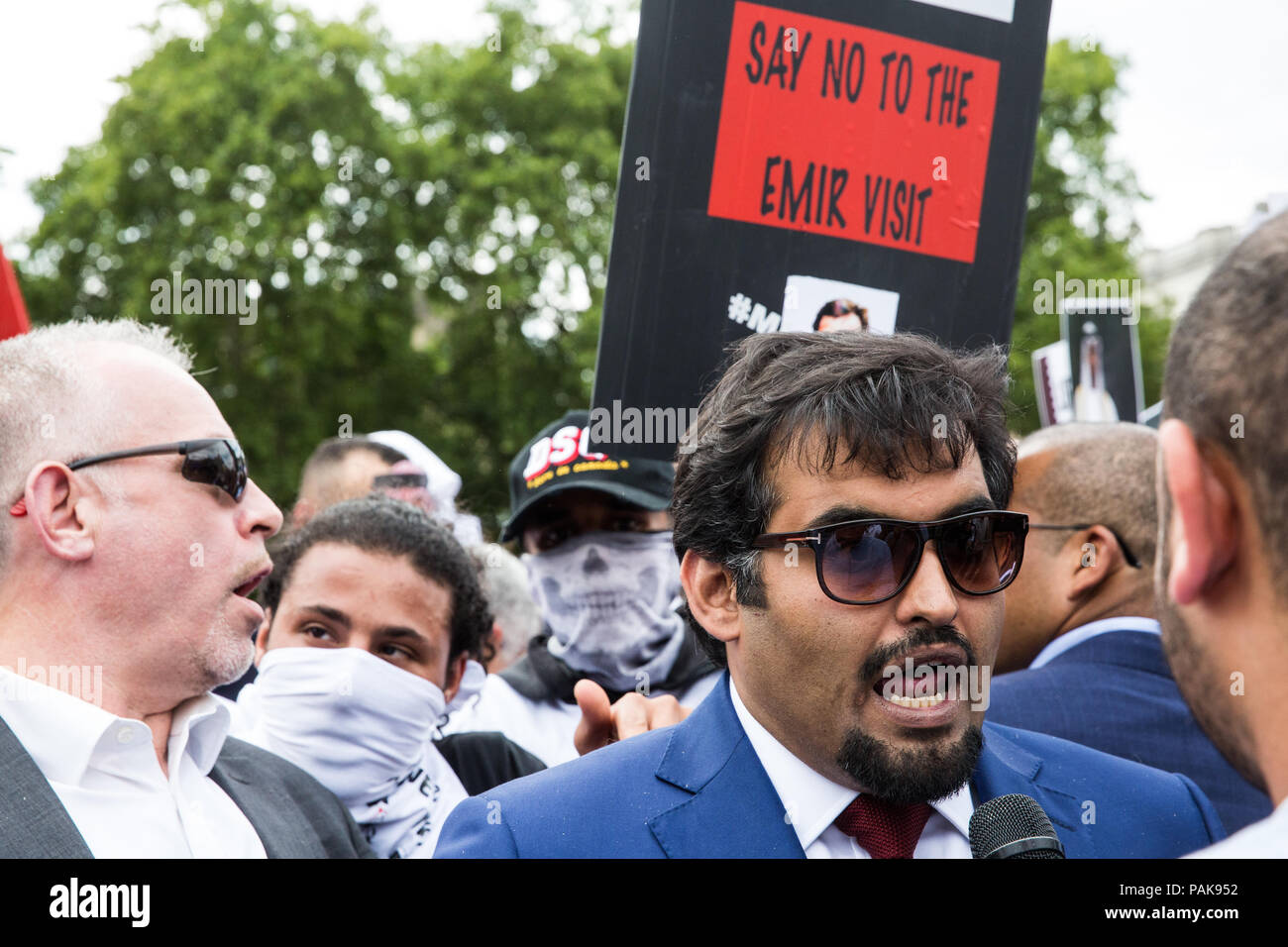 London, UK. 23rd July, 2018. Khalid Al-Hail, founder and president of the Qatar National Democratic Party (QNDP), speaks to the media in front of a protest by opponents of a visit to the UK by Qatar’s Emir Tamim Bin Hamad Al Thani in Parliament Square against Qatari support for extremist and terrorist groups. There was also a smaller counter-protest. Emir Tamim is expected to meet Prime Minister Theresa May during his visit. Credit: Mark Kerrison/Alamy Live News Stock Photo