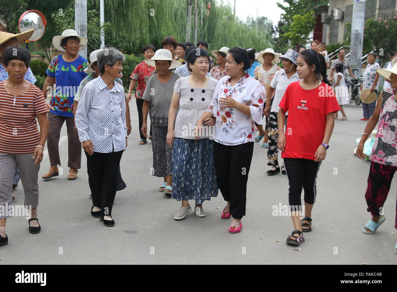 Zoucheng, shandong, China, 23rd July 2018. Seven years after his disappearance, meng qingrong finally returned to his hometown in zhaozhuang village and saw two daughters crying into tears. When she left home, her eldest daughter was 21 years old and her younger daughter was 8.Credit:Costfoto/Alamy Live News Stock Photo