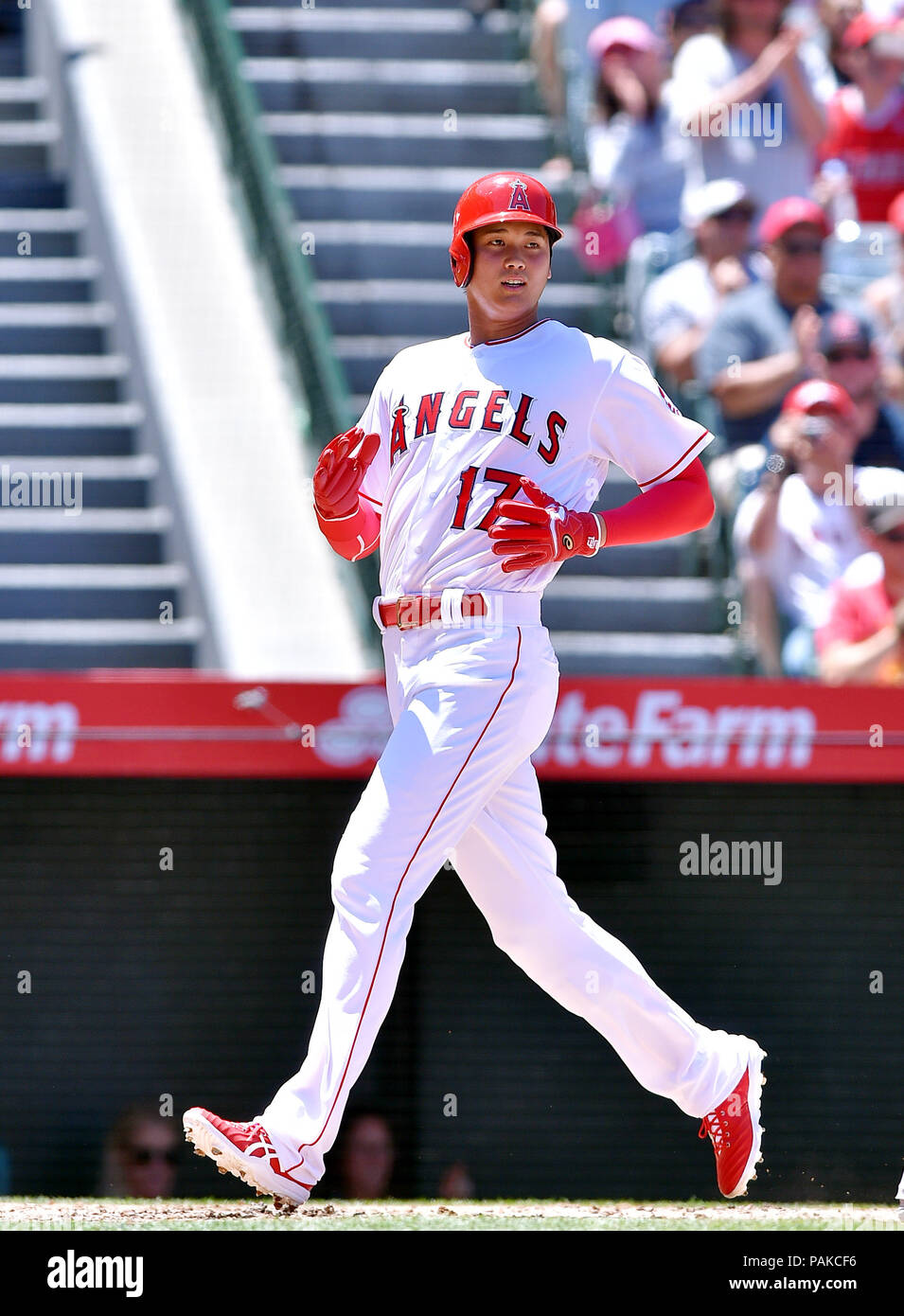 Los Angeles Angels designated hitter Shohei Ohtani crosses home plate to score on an RBI double by Luis Valbuena (not pictured) during the Major League Baseball game against the Texas Rangers at Angel Stadium in Anaheim, California, United States, June 3, 2018. Credit: AFLO/Alamy Live News Stock Photo