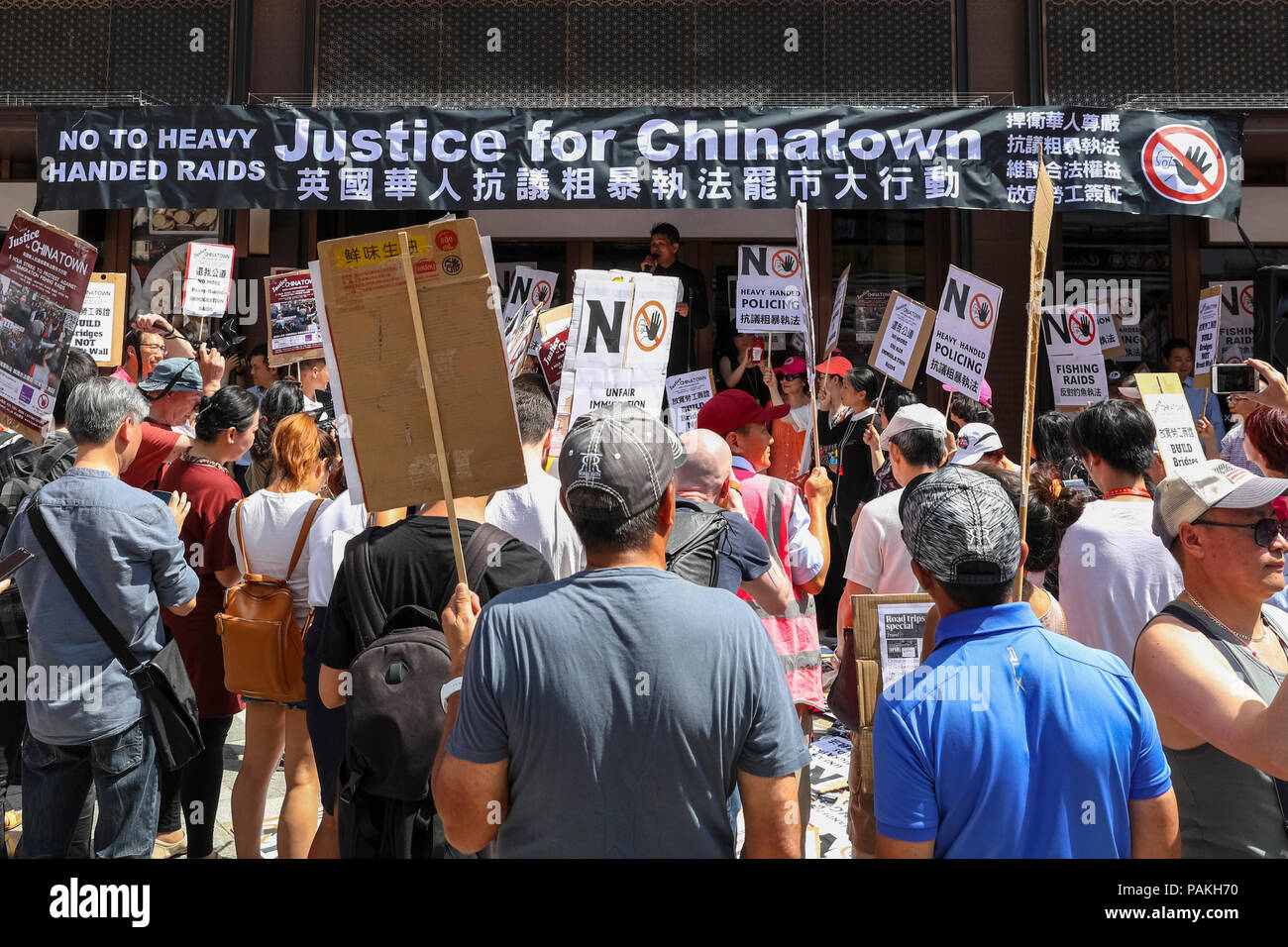 London, UK, 24th July 2018. Protesters comgregate in Chinatown. Businesses in London’s Chinatown stage a five-hour shut down protest against recent immigration raids, and march from Chinatown to the Home Office in Westminster. The London Chinatown Chinese Association (LCCA) alleges unreasonable behaviour of police officers during the raids, this is disputed by Scotland Yard. Credit: Imageplotter News and Sports/Alamy Live News Stock Photo