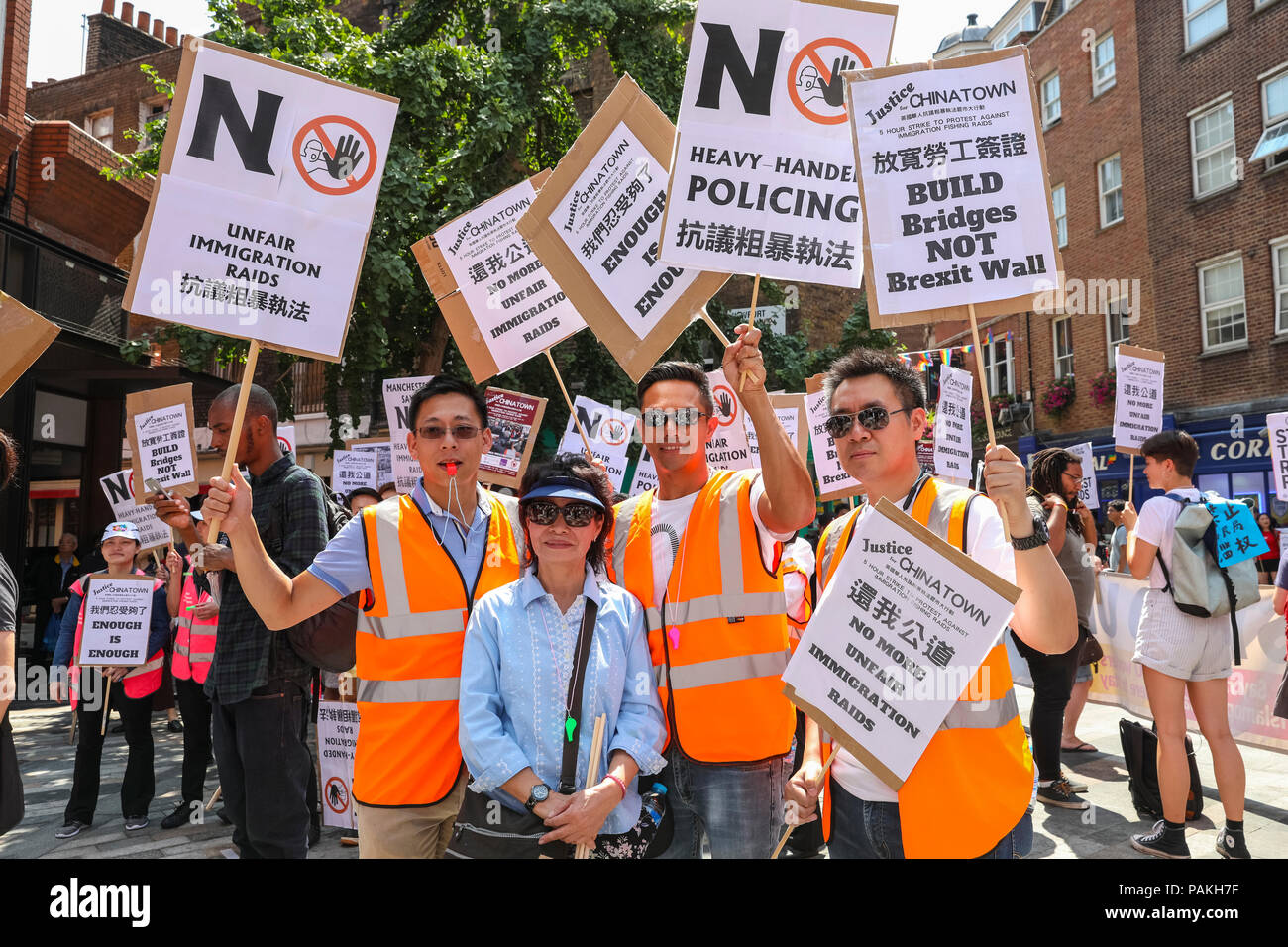 London, UK, 24th July 2018. Protesters comgregate in Chinatown. Businesses  in London's Chinatown stage a five-hour shut down protest against recent  immigration raids, and march from Chinatown to the Home Office in