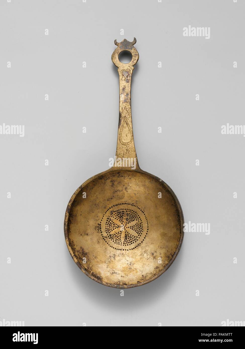 Strainer. Culture: Etruscan. Dimensions: Other: 11 9/16 x 5 3/8 in. (29.4 x 13.7 cm). Date: 5th century B.C.. Museum: Metropolitan Museum of Art, New York, USA. Stock Photo